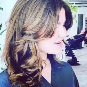 Woman with styled hair at salon