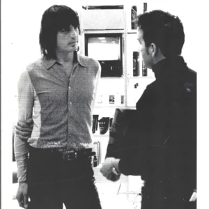 Discussion between two men in tech shop