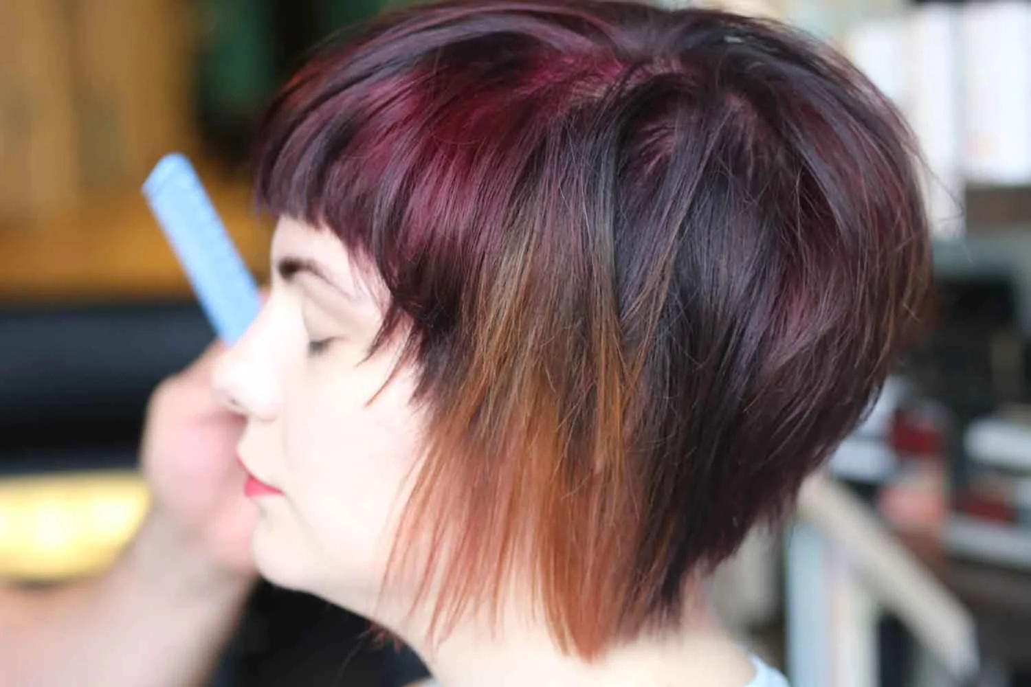 Woman with stylish asymmetrical haircut.
